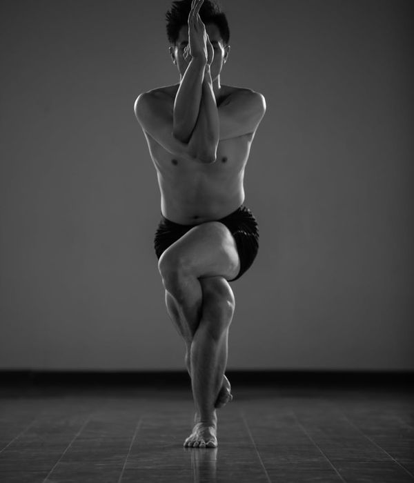Man in a calm, focused pose for static balance exercise.